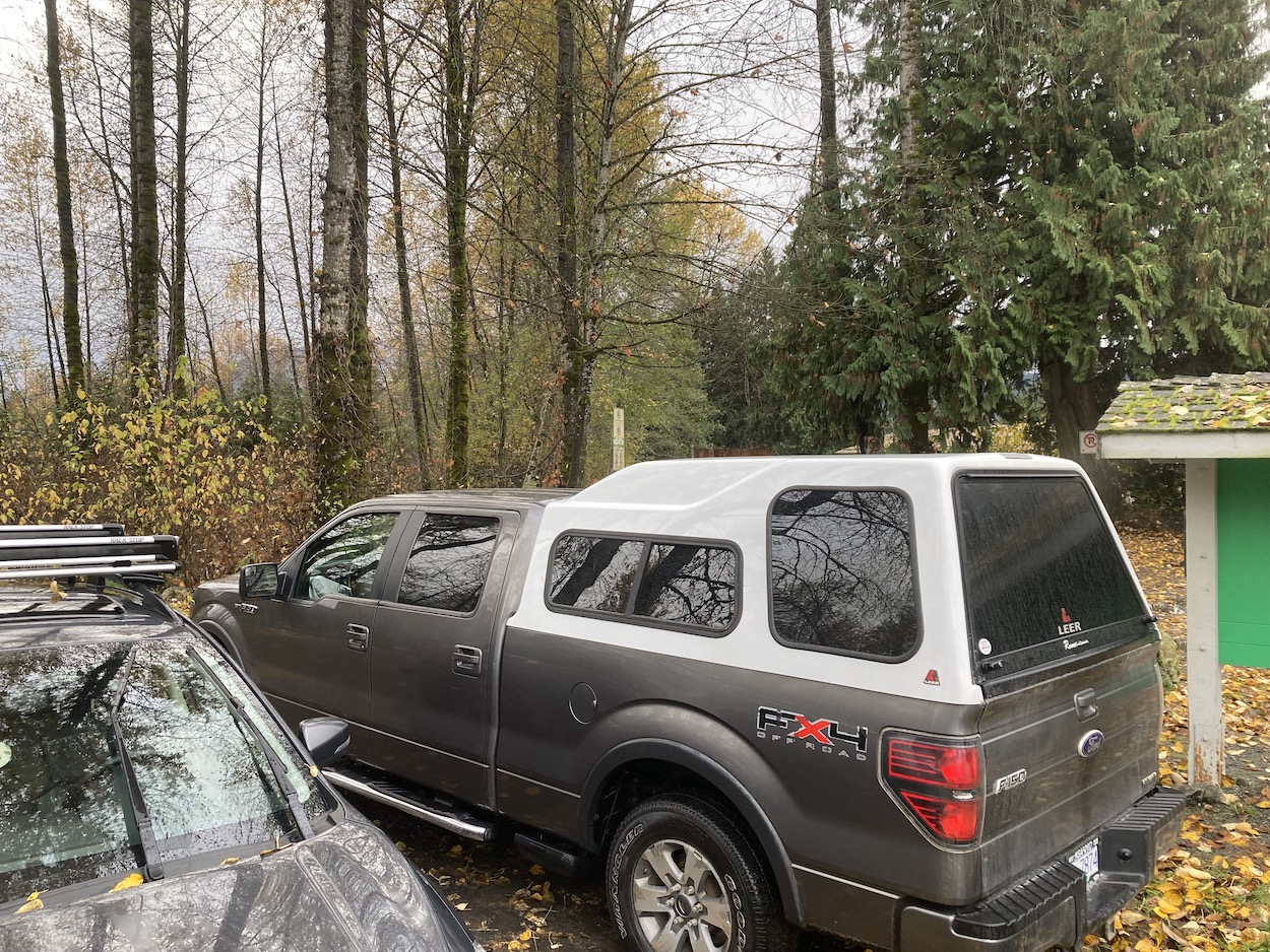 camping in truck at a trailhead 