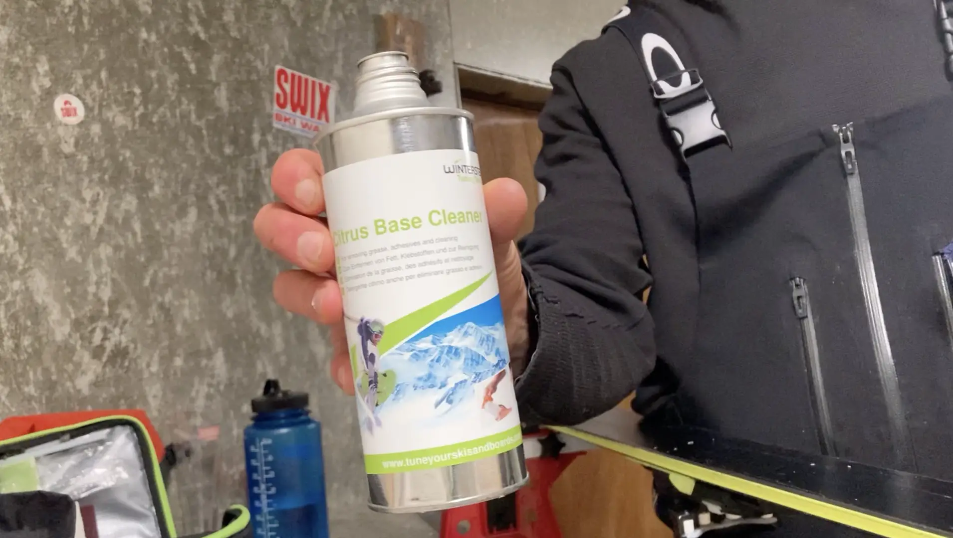 cleaning ski bases to prep for waxing using a citrus cleaner 